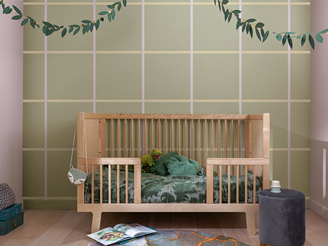 nursery painted in forest hues with hints of violet and check paint effect