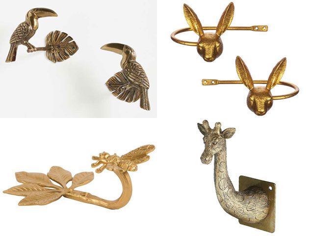 a selection of brass animal curtain tie backs on a white background