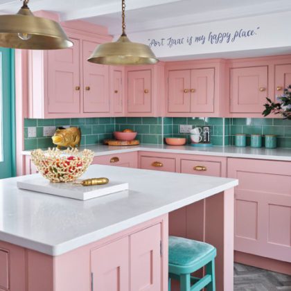 pink and green kitchen with pink cabinets and green tiles