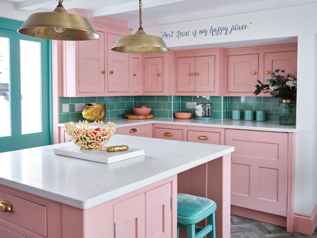 pink and green kitchen with pink cabinets and green tiles
