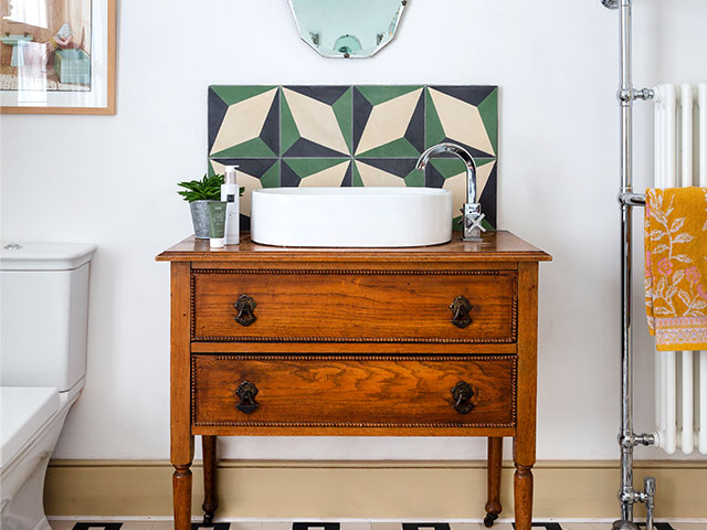 Edwardian bathroom makeover with vintage vanity unit and geometric splashback tiles
