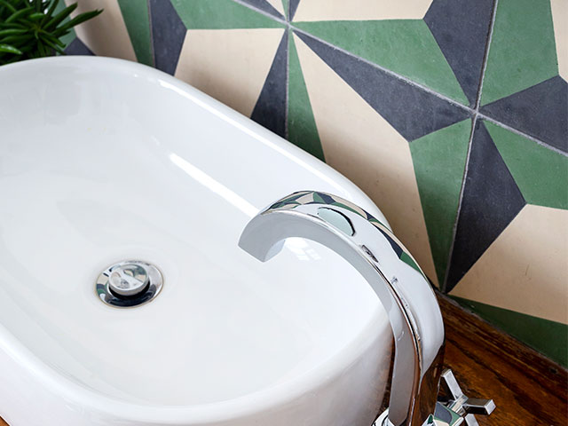 The pop of green in the Fired Earth splashback works well with the vintage unit