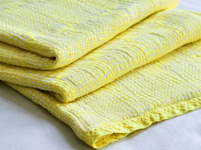yellow throws for sofas made from sustainable recycled plastic