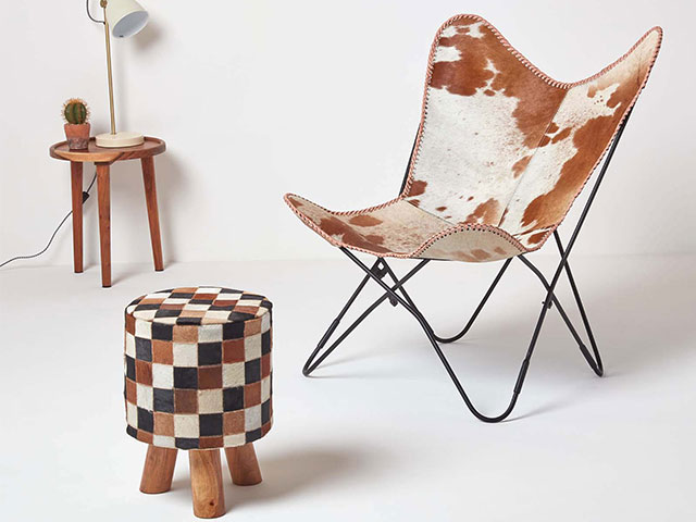 A tan, black, brown, and cream chequerboard stool is a great statement piece
