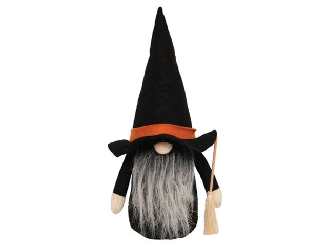 black wizard doll with pointy hat, orange trim and broom from Tesco