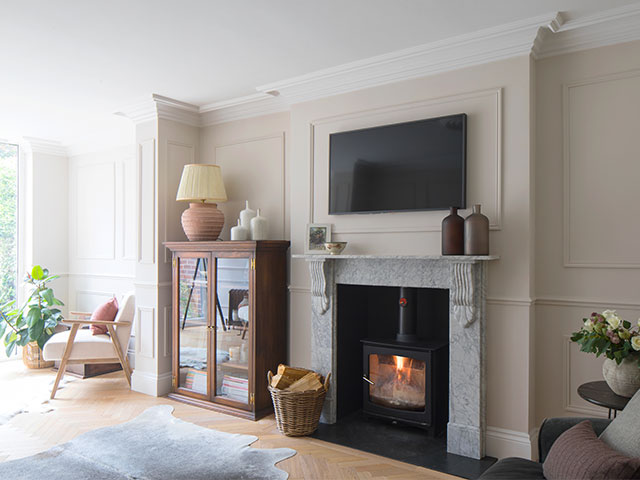 period home with wood burning stove in a traditional fire surround in a neutral living room