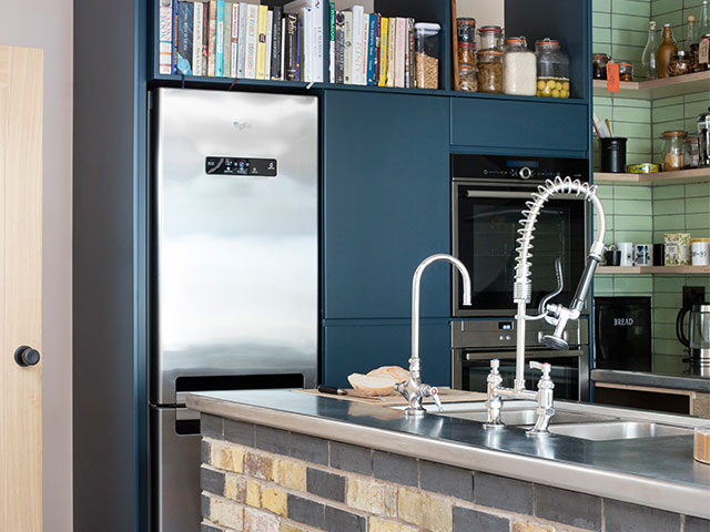 Colour was added with blue painted units and delicate sea green tile in the industrial kitchens