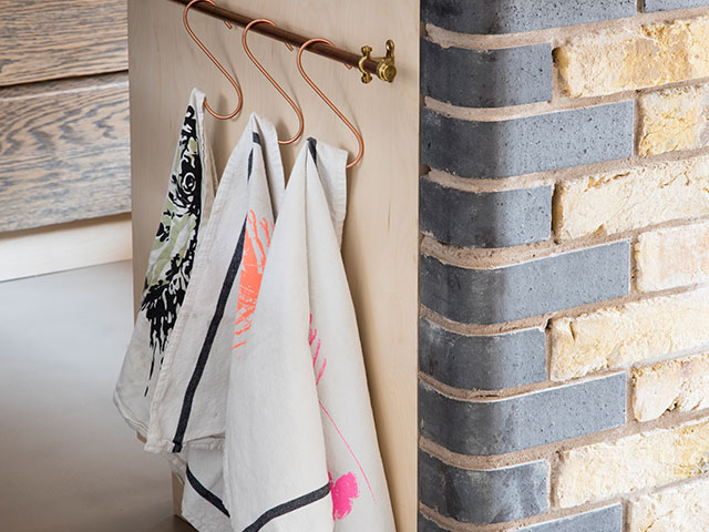 Quirky tea towels and reclaimed brick frontage