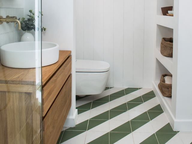 The striped floor in the accessible bathroom is striking