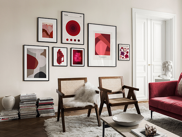 Pantone Colour of the Year 2023 in a gallery wall in a living room with magenta sofa