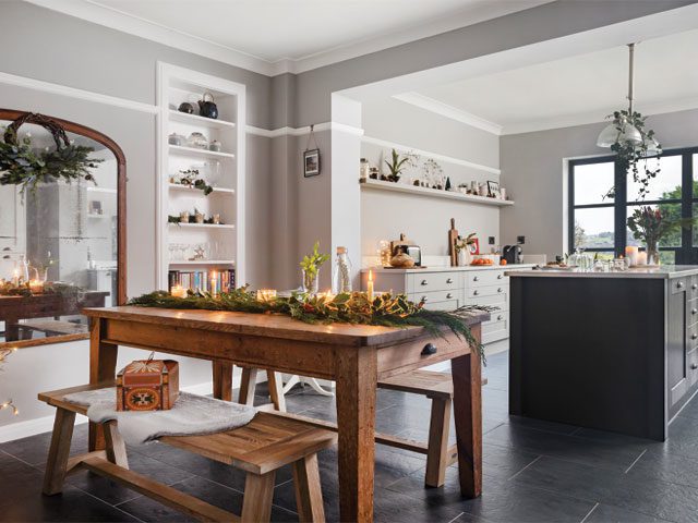 1930s home decor ideas: alcove shelves and the picture rail were retained when creating this open-plan kitchen diner with chunky wooden dining table