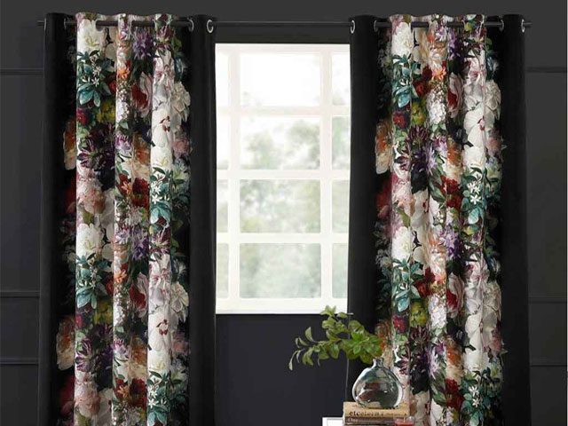 dark velvet floral print curtains hand painted by artists in a room with dark panelled walls