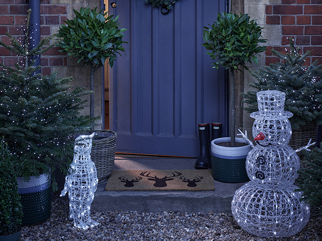 Light up penguins and snowmen make a fun Christmas doorscape