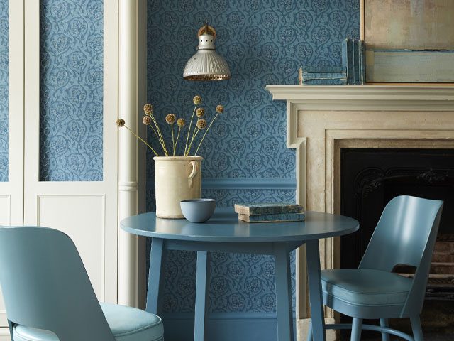 colour-drenched living room with Little Greene x National Trust Wallpaper in blue, blue table and chairs, and blue skirting board and dado rail