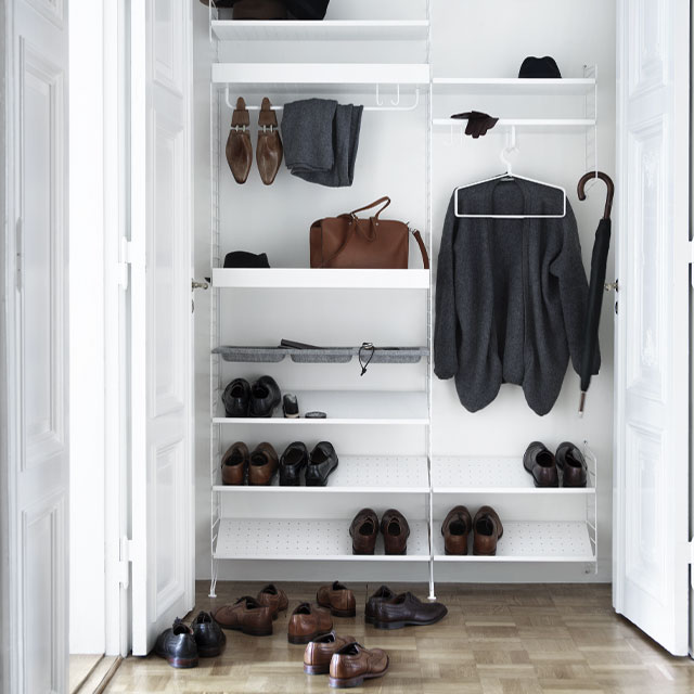 String Furniture white open-shelving system for shoes and coats 