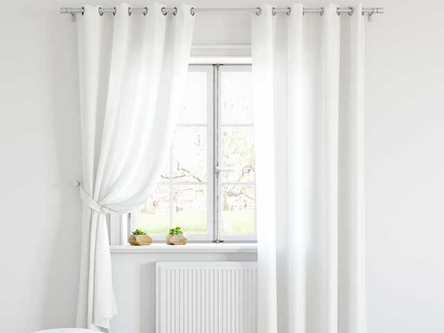 white voile curtains in a white living room