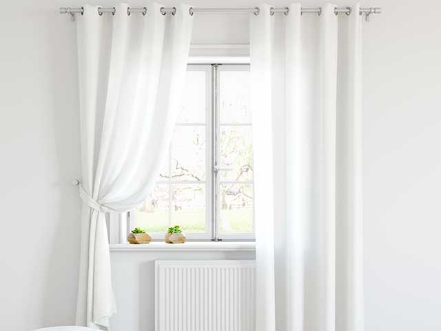 white voile curtains in a white living room