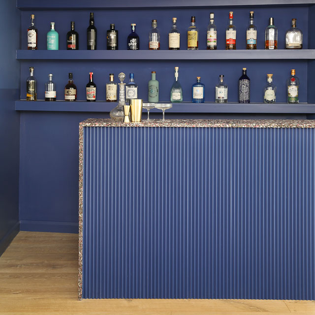 original bar found in a Scottish bungalow reinstated and modernised with blue colour blocking and terrazzo worktop