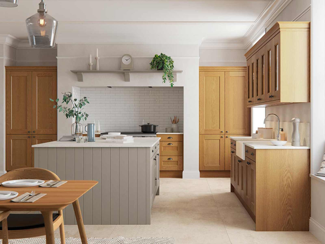large l-shaped kitchen with large island and cabinets in natural wood and grey