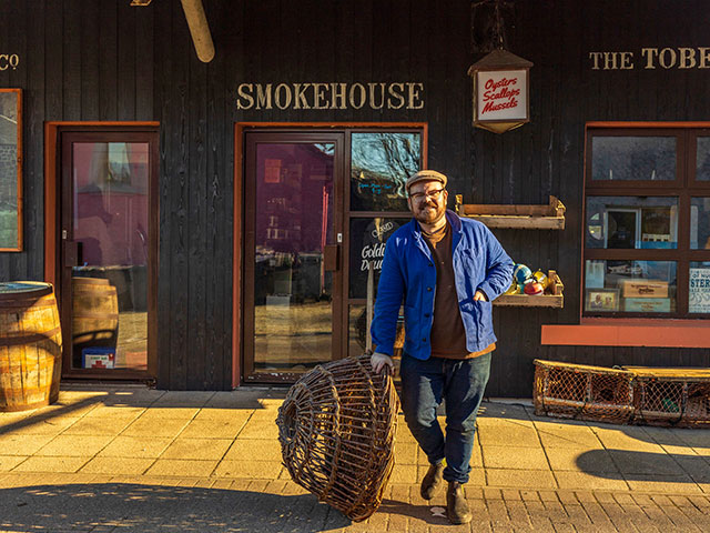 Banjo outside the smokehouse in the first episode of Designing the Hebrides