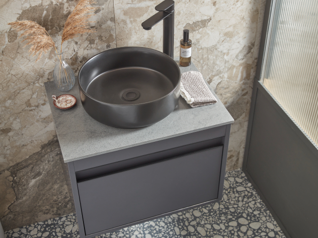 Marble or Travertine tiles can make a bathroom feel bigger