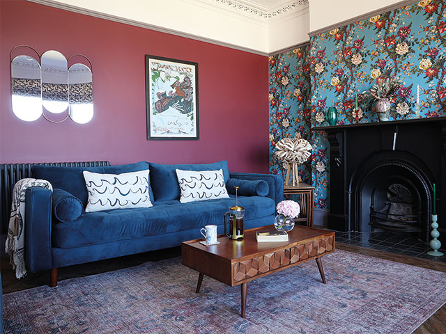 Liberty wallpaper hangs above the fireplace