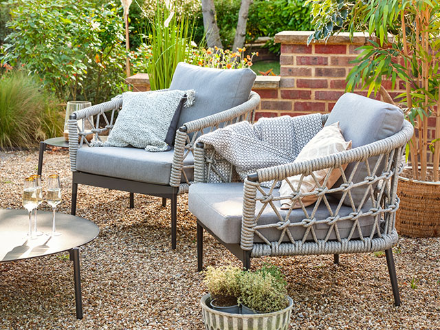 garden armchairs in courtyard style space