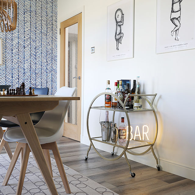 Bar area of open plan kitchen makeover with hardwood flooring