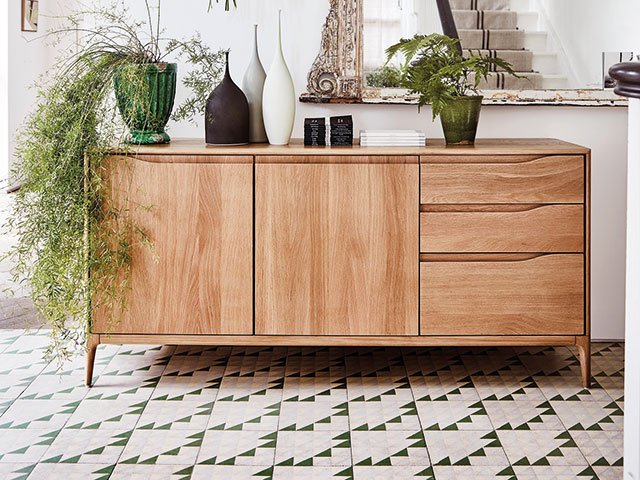 Hallway with wooden sideboard and tiled flooring