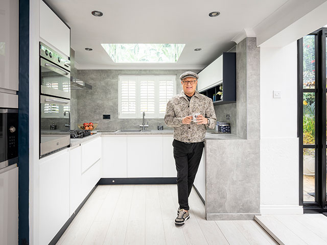 Paul Rowland in grey stone kitchen