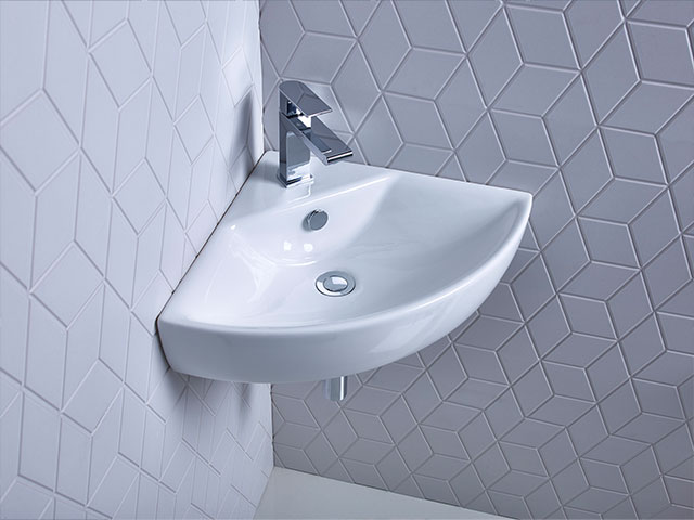Up your bathroom space saving with this chic corner sink