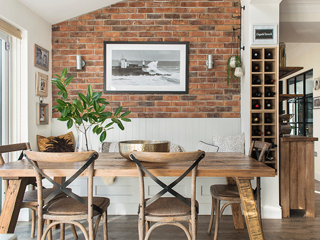 Exposed brick and white walls in the dining room