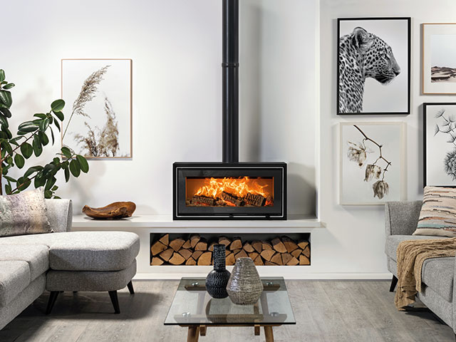 The Stovax wood burner stores plenty of logs underneath and is a great heating system