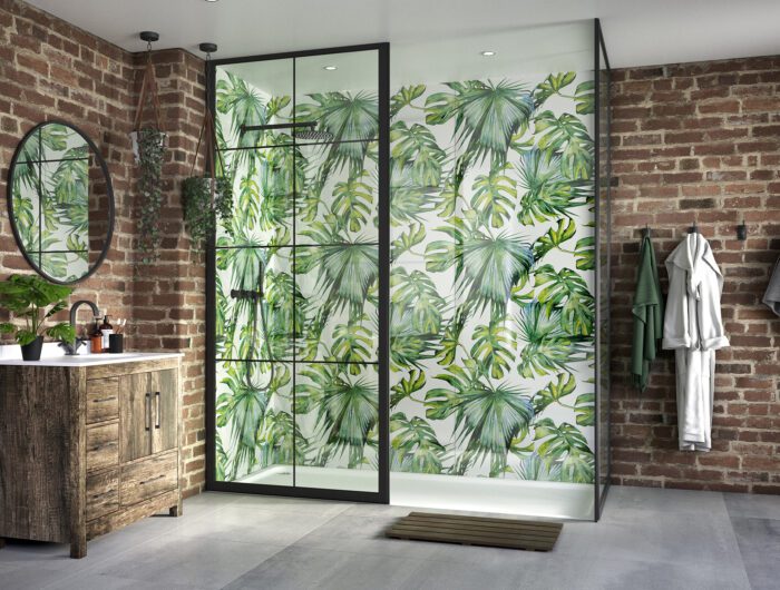 A bathroom with a tiled botanical feature wall