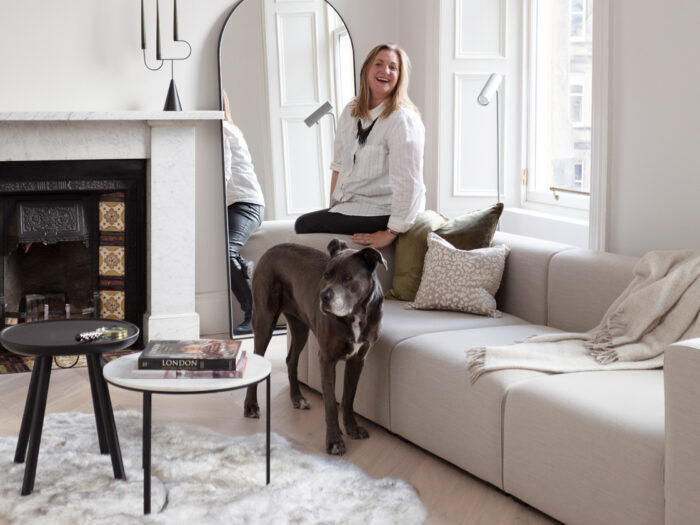 Cathy Dean Founder of Newcastle based Studio Dean in living room with dog