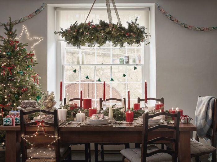 Nostalgic Red Green and Gold Christmas Dining Table with Hanging Wreath