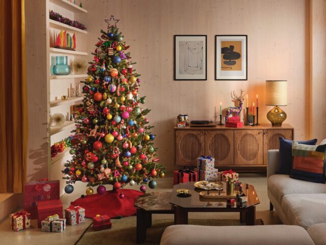 Christmas tree in Scandi living room with multicoloured baubles