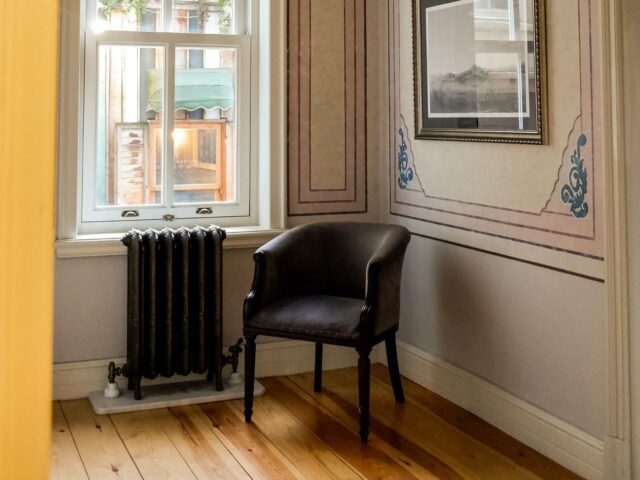 Radiator in room with chair