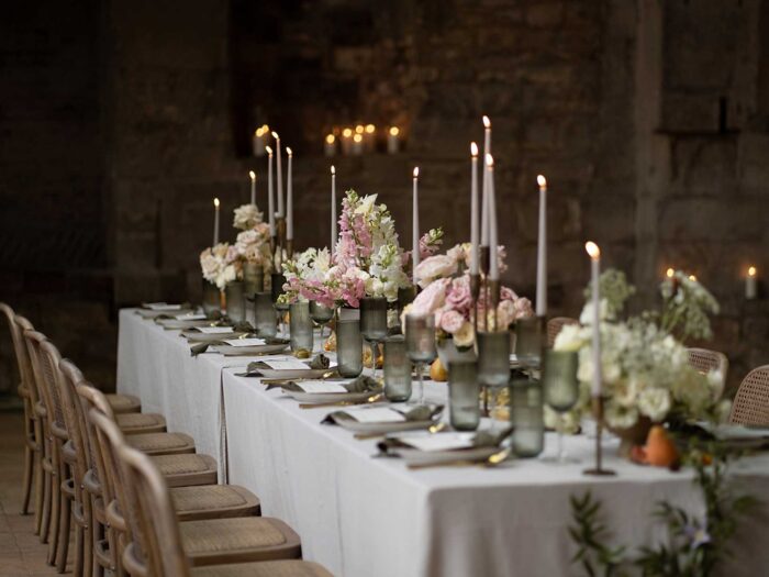 Varied heights for tapered candles soften an ordered tablescape