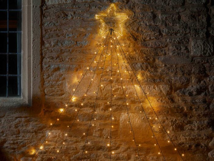 Style a Christmas tree in lights on the wall of your house