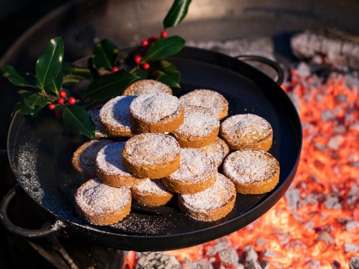 Use your outside space and warm mince pies on a firepit