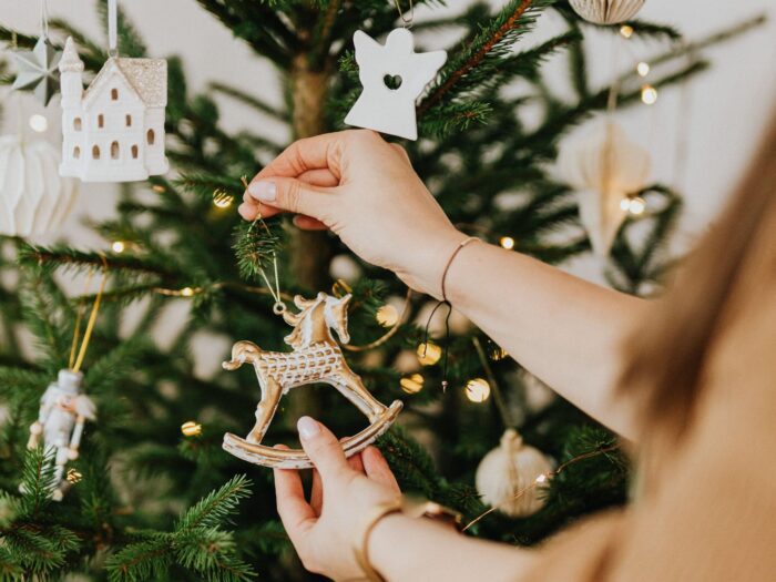 Hanging decorations on a Christmas tree