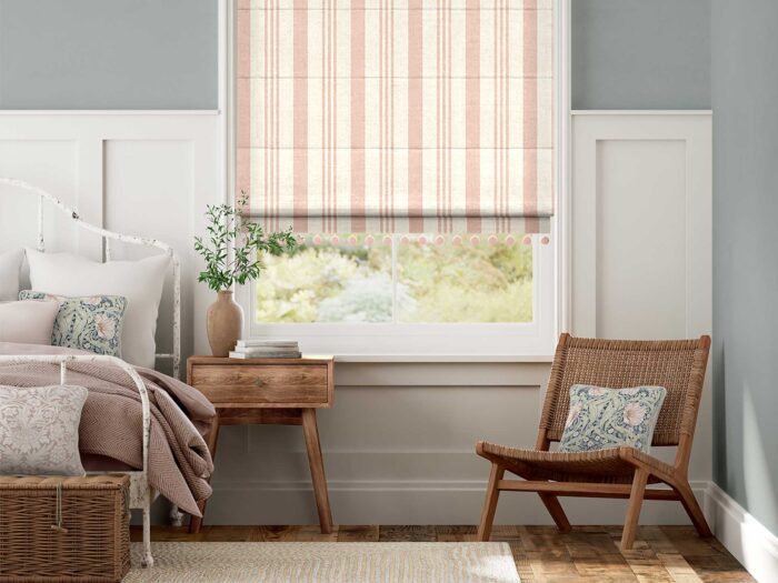 Bring Peach Fuzz into the room with subtle stripes in soft furnishings