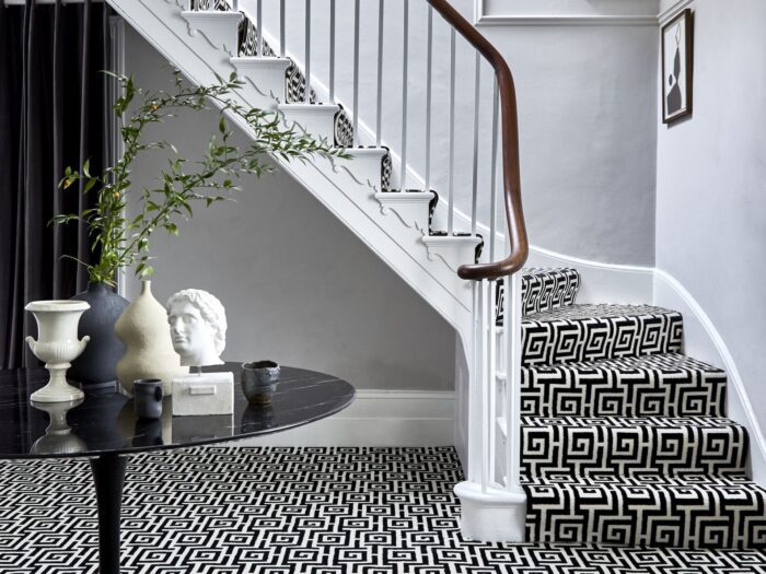 Greek key monochrome carpet in entrance hall and up stairs