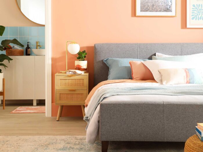 Match your pillows and throws to your walls in warm shades