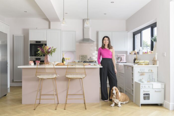 Ashley Newcombe feature portrait in pink and gold kitchen