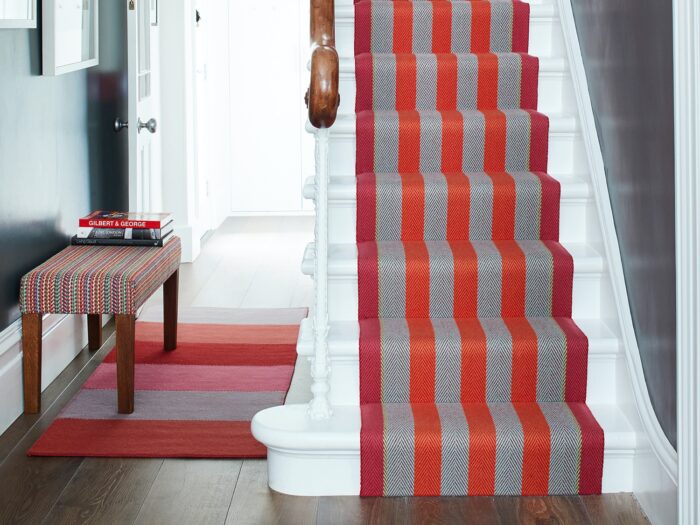 Bright pink and orange striped stair runner