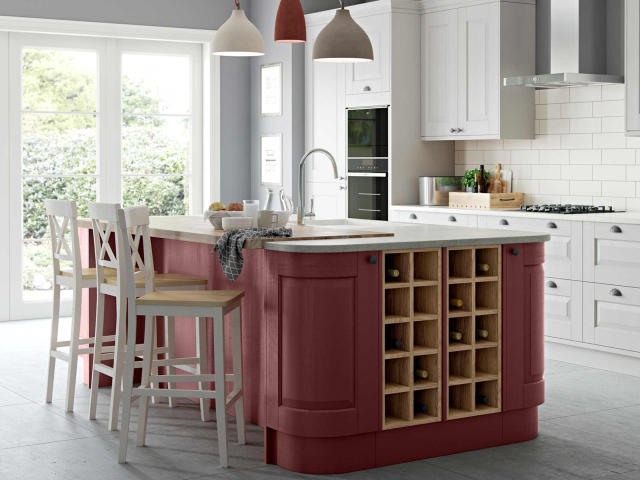 (A perfect kitchen with curved doors and wine racks in a kitchen island)