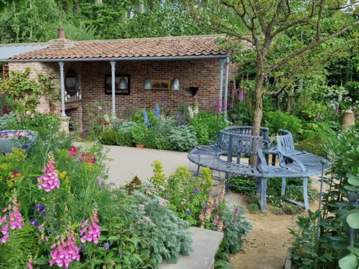 Garden at Chelsea 2023 with circular bench around tree