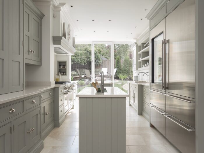 Pale grey galley kitchen with slimline island